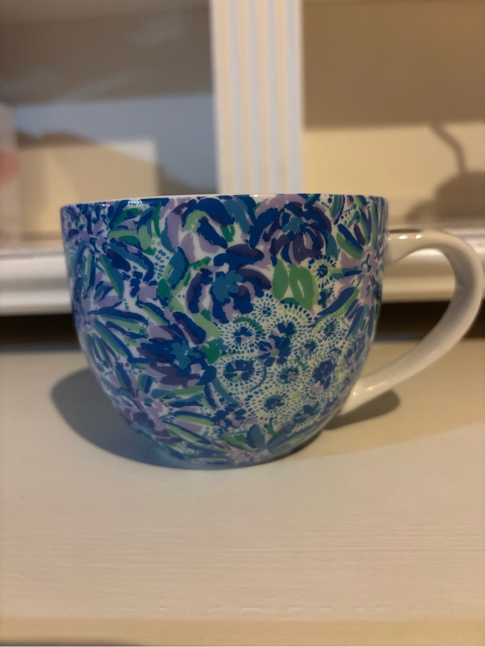 Pretty Lilly Pulitzer mug in blue, purple & teal. Some wear on handle. Large.